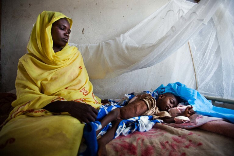 A-woman-with-her-acutely-malnourished-baby-at-a-Darfur-hospital-File-photo-Albert-Gonzalez-Farran-UNAMID-768x512