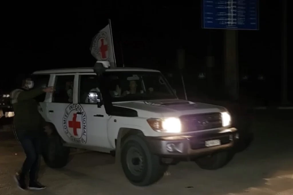 a-red-cross-van-carrying-hostages-out-of-gaza