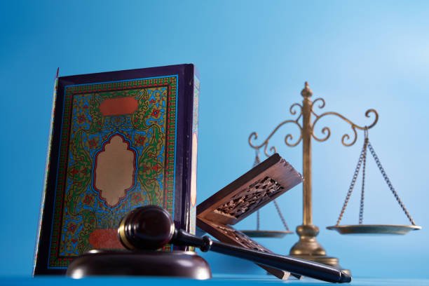 sharia law concept , gavel hammer libra scale and holly koran