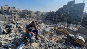 Palestinians search for casualties a day after Israeli strikes on houses in Jabalia refugee camp