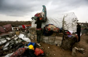 AA-20250212-37030967-37030928-FAMILY_STRUGGLES_TO_SURVIVE_ON_THE_RUINS_OF_THEIR_HOME_IN_GAZA-1739362352
