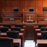 Red wood table and red chair in the justice court