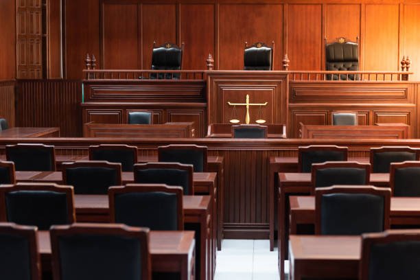 Red wood table and red chair in the justice court